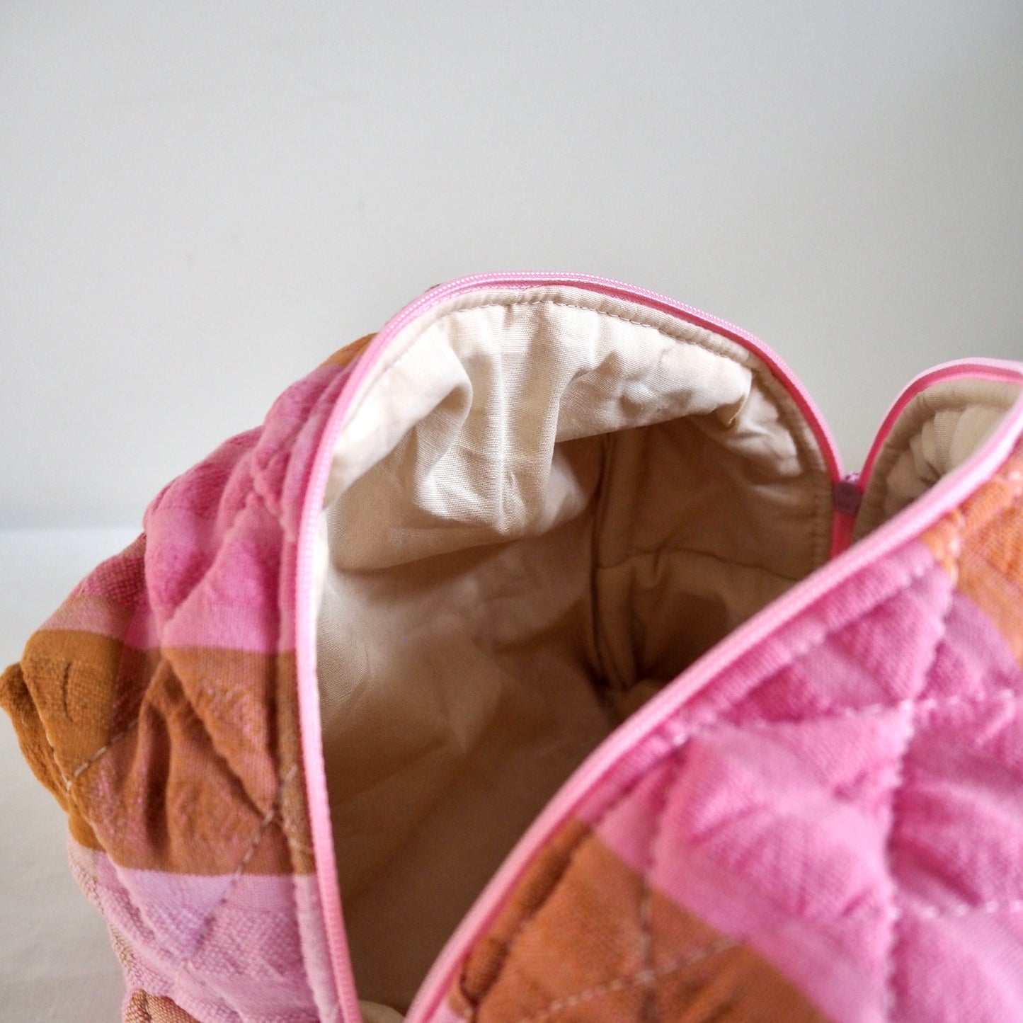 UP-CYCLED PINK AND ORANGE SEERSUCKER QUILTED MAKEUP BAG