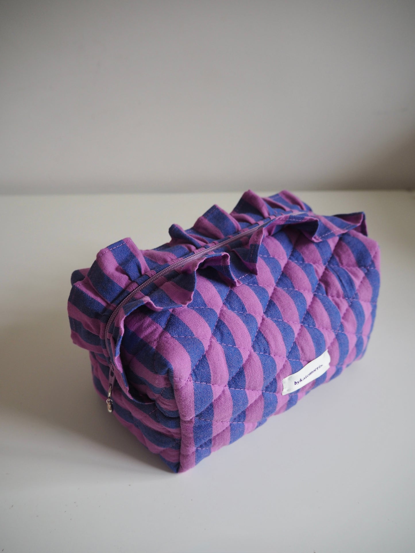PURPLE STRIPE FRILL QUILTED MAKEUP BAG
