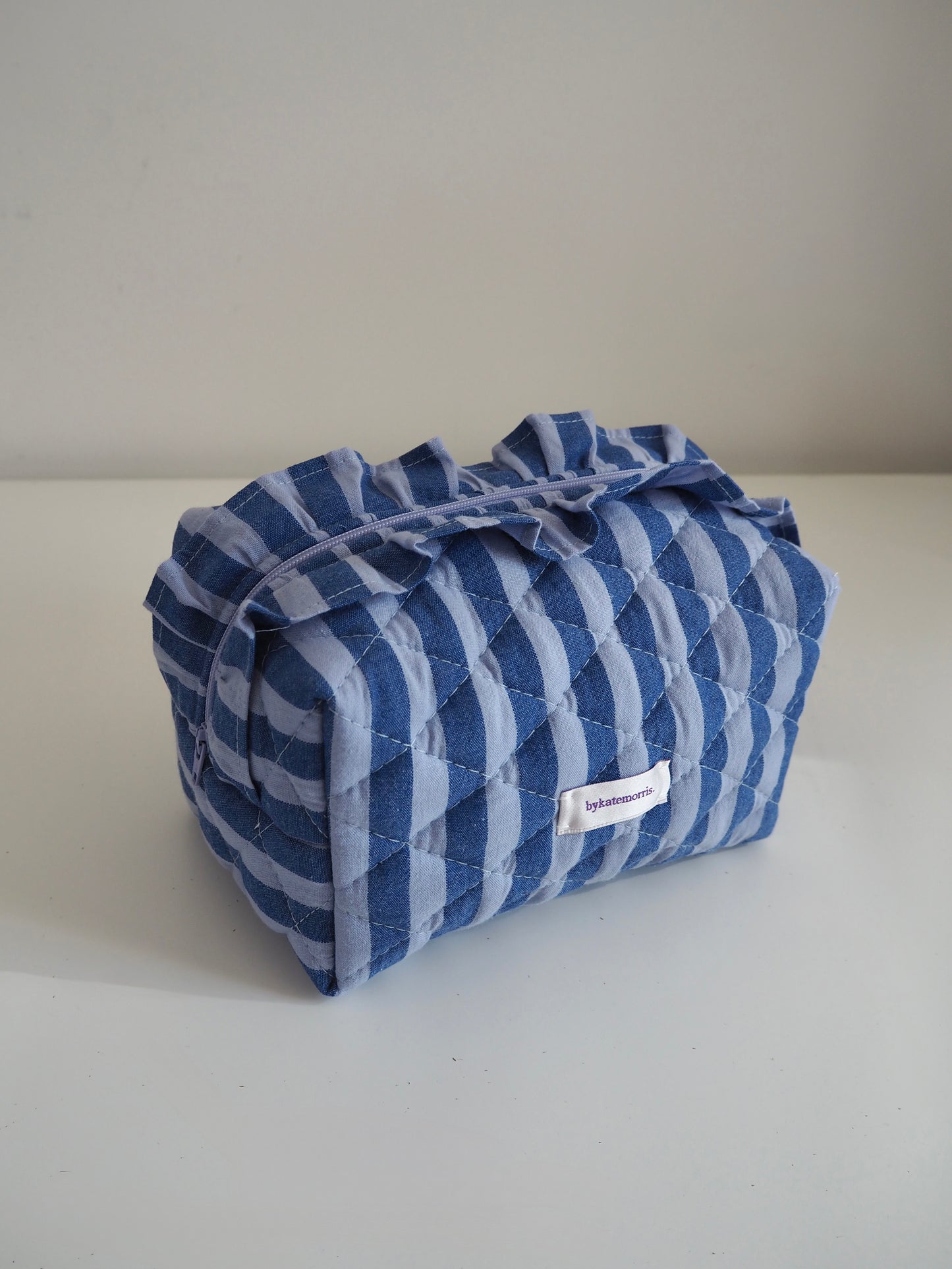 BLUE STRIPE FRILL QUILTED MAKEUP BAG