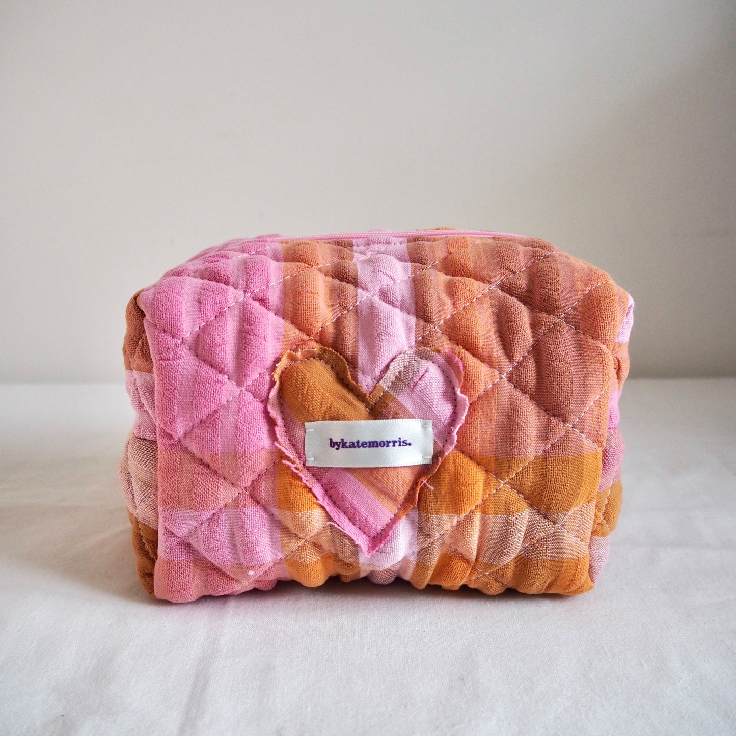 UP-CYCLED PINK AND ORANGE SEERSUCKER QUILTED MAKEUP BAG