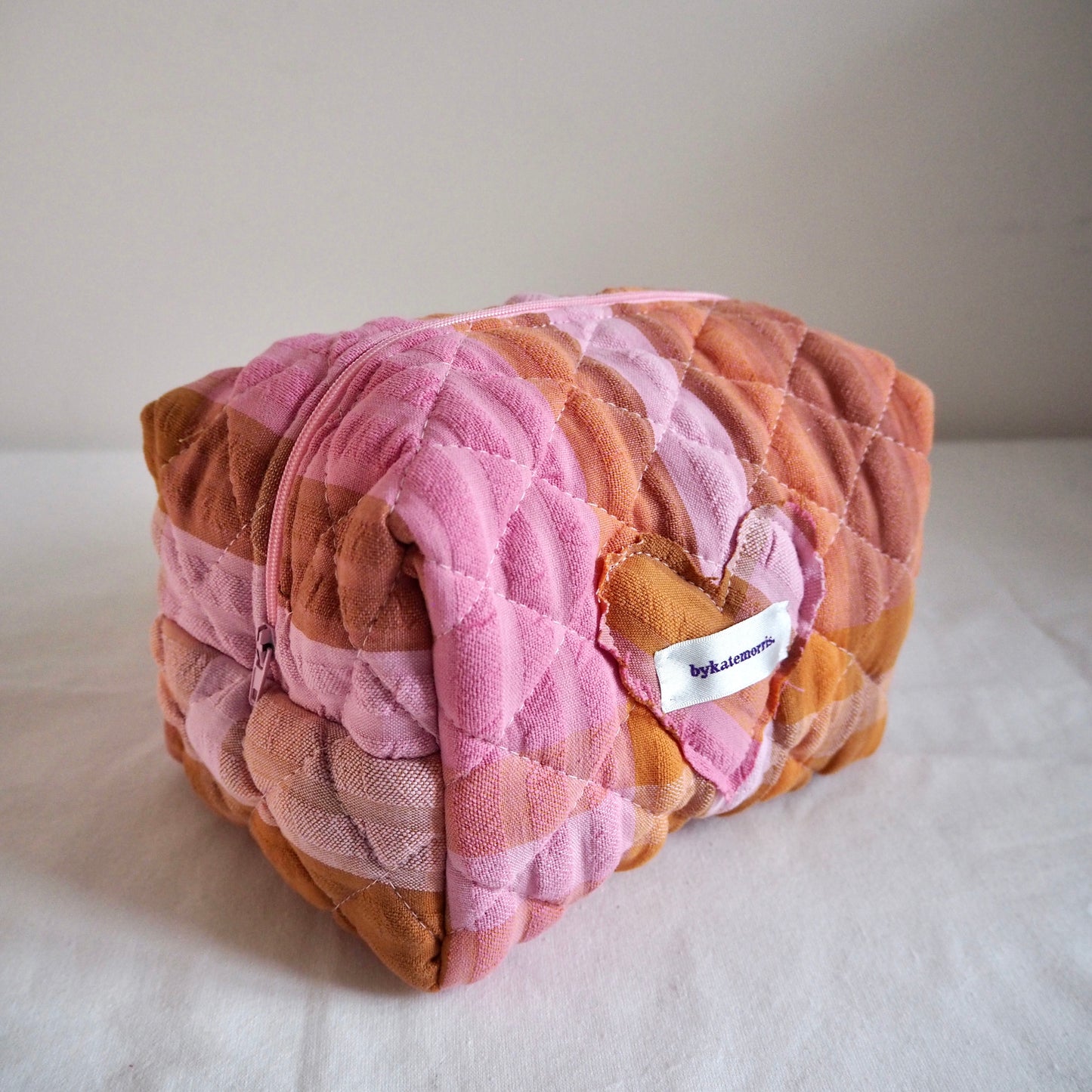 UP-CYCLED PINK AND ORANGE SEERSUCKER QUILTED MAKEUP BAG